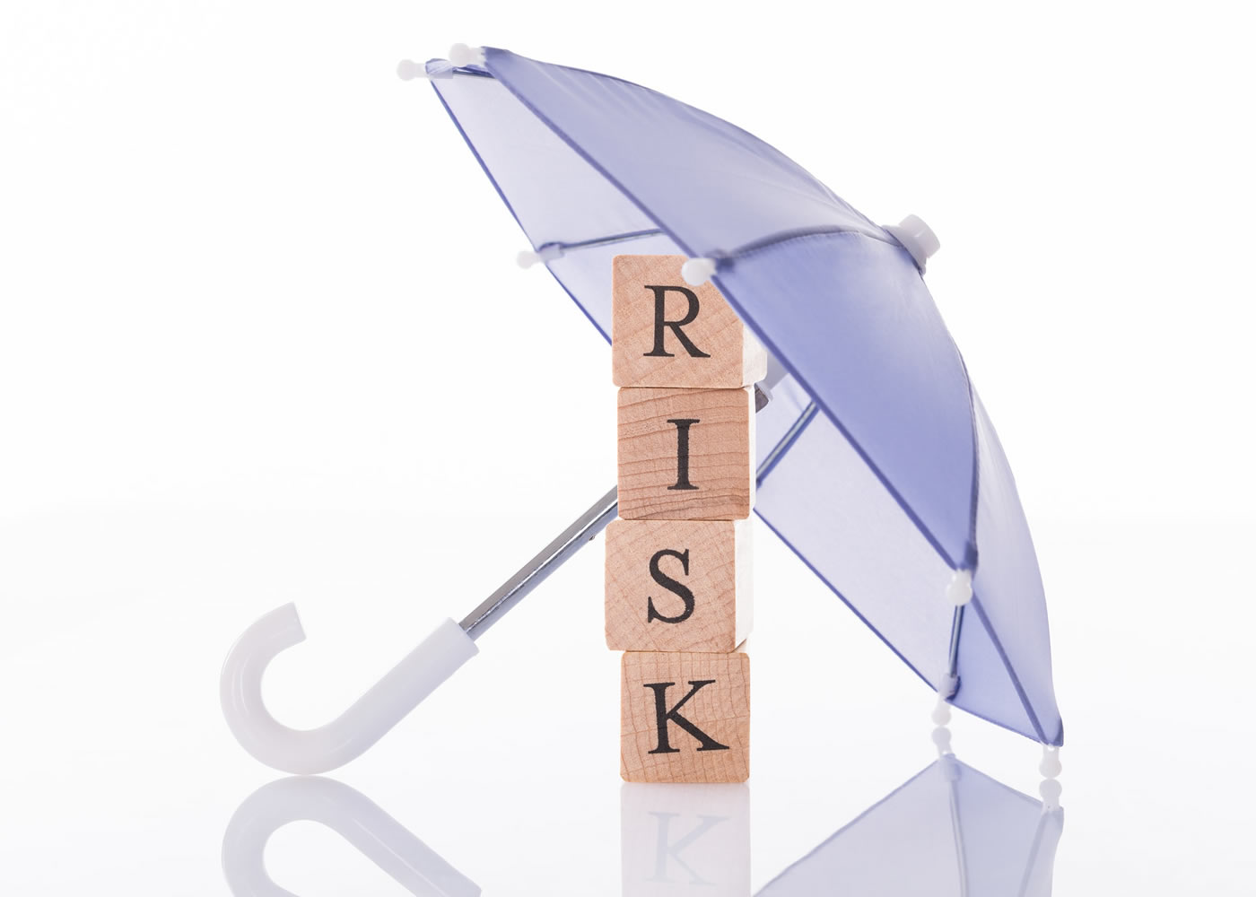 naem-2018-article-risk-wooden-blocks-under-umbrella-isolated-700x500